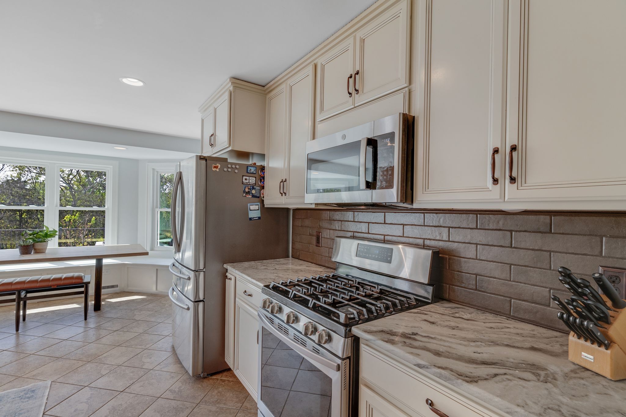 1055 Franklin Road Gallatin, TN 37066 - Photo 29 of 60 a kitchen with granite countertop a stove and a refrigerator