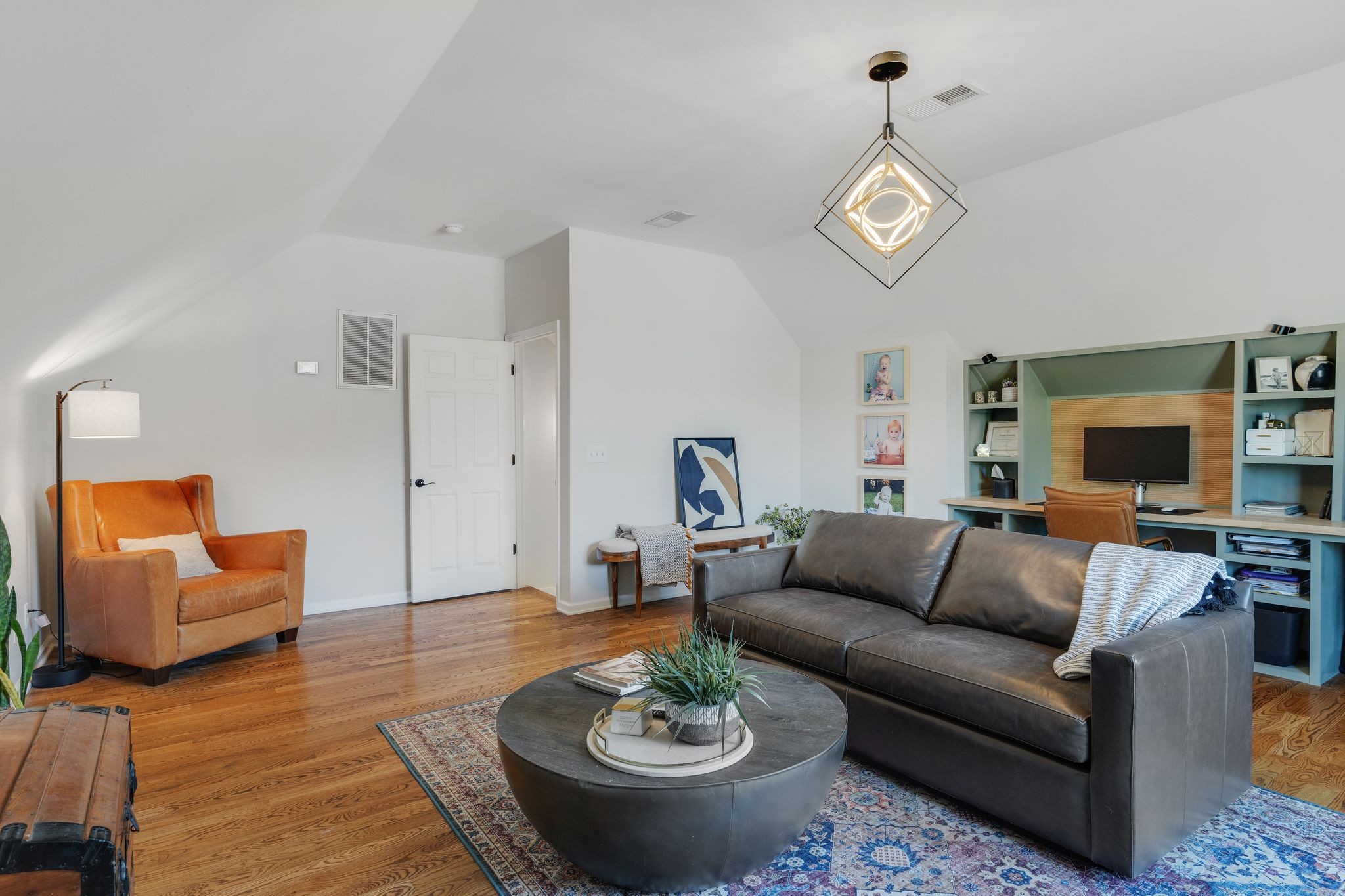 1055 Franklin Road Gallatin, TN 37066 - Photo 37 of 60 a living room with furniture a rug and a flat screen tv