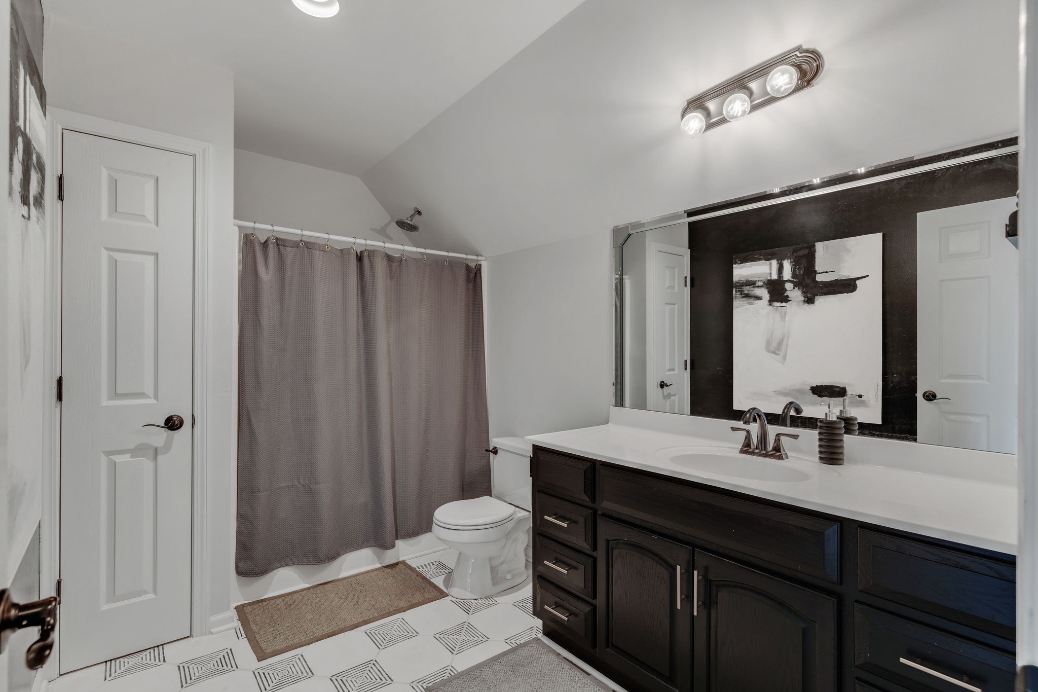 1055 Franklin Road Gallatin, TN 37066 - Photo 44 of 60 a bathroom with a double vanity sink a toilet and a mirror