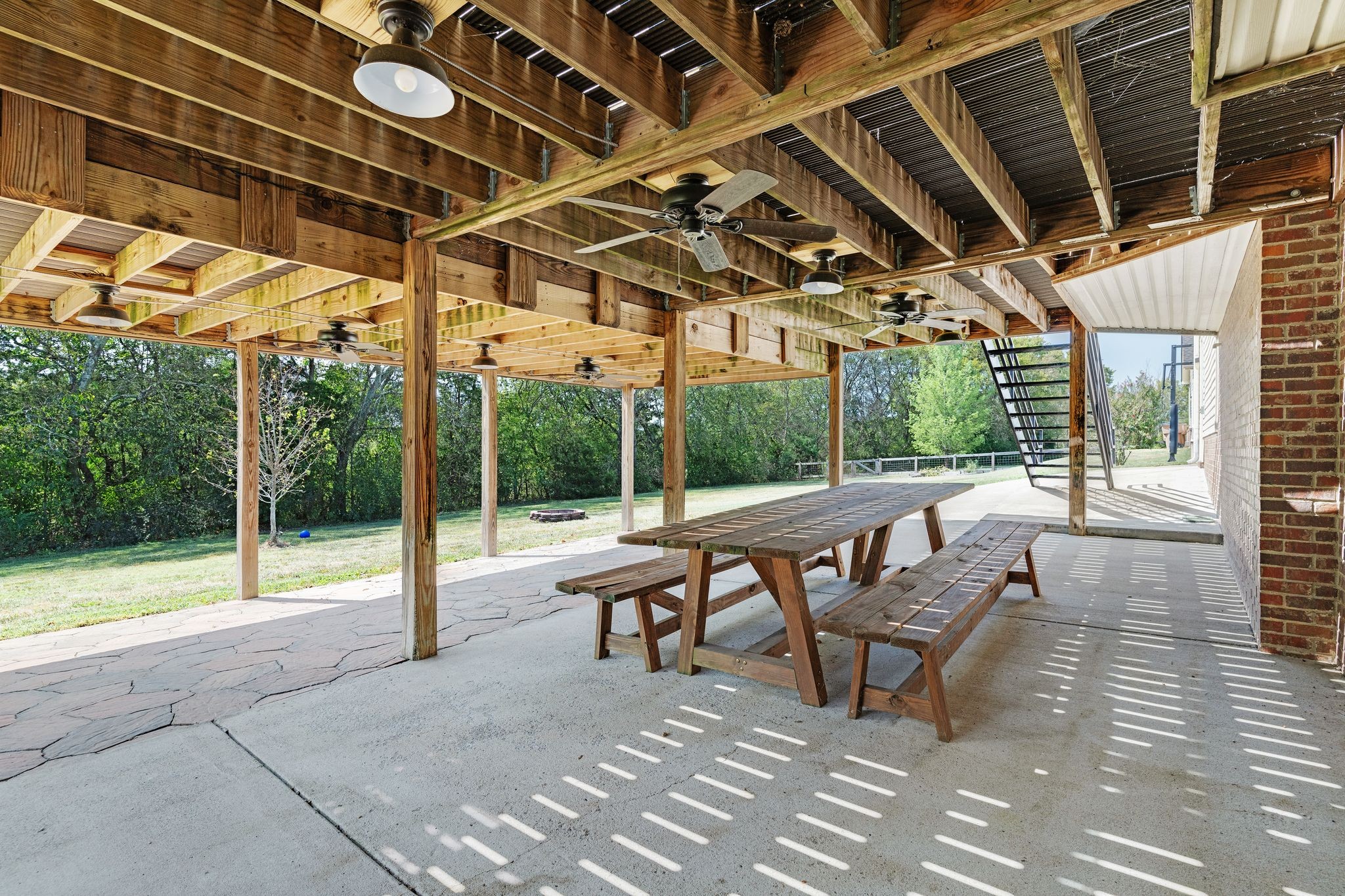 1055 Franklin Road Gallatin, TN 37066 - Photo 53 of 60 a view of a patio with a table and chairs
