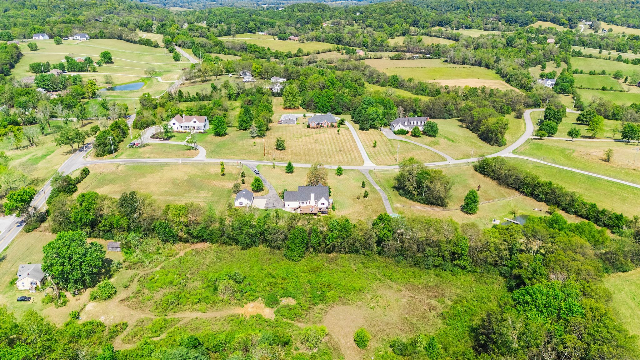 1055 Franklin Road Gallatin, TN 37066 - Photo 55 of 60 an aerial view of residential houses with outdoor space and trees all around