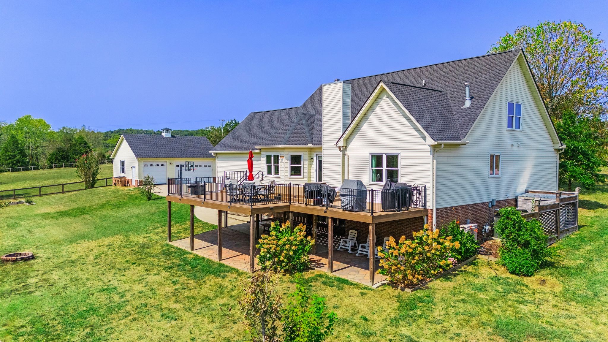 1055 Franklin Road Gallatin, TN 37066 - Photo 9 of 60 a front view of a house with garden and sitting area