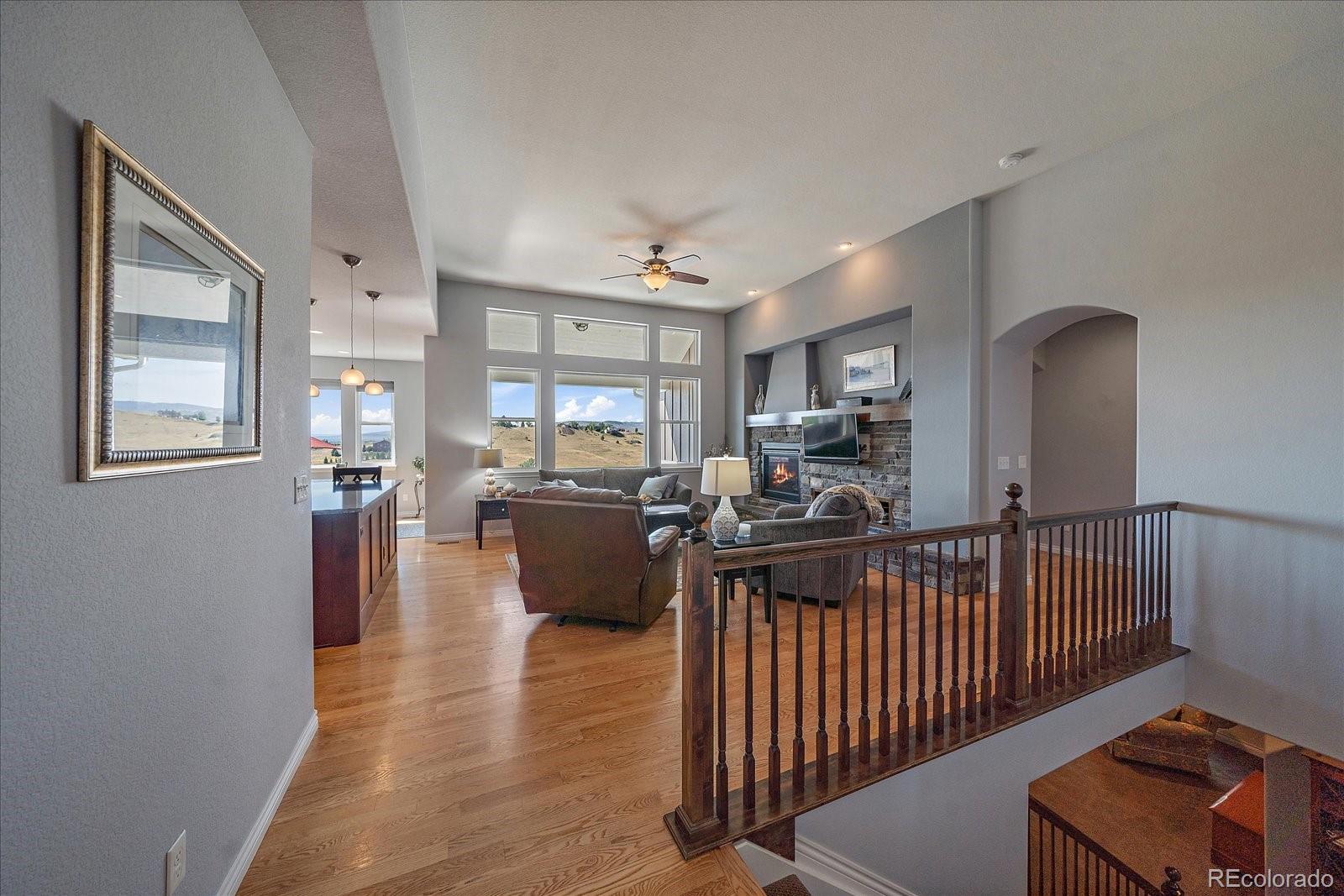 8412 Quaker Circle Arvada, CO 80007 - Photo 12 of 44 a view of a living room and dining room