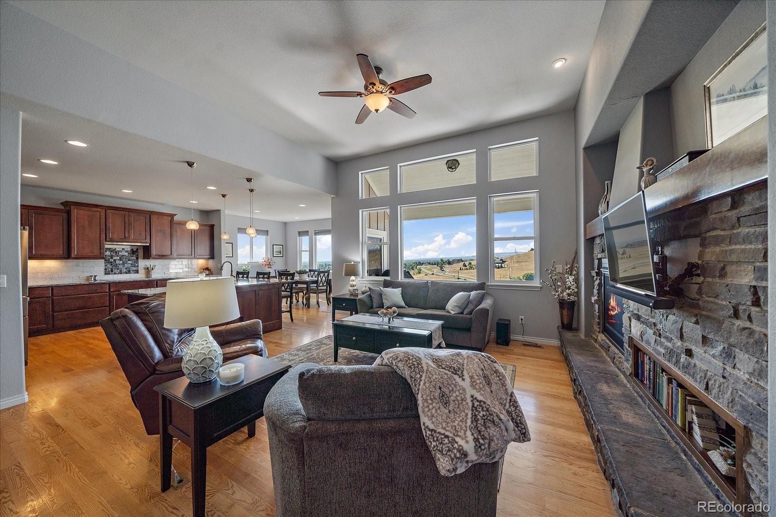 8412 Quaker Circle Arvada, CO 80007 - Photo 15 of 44 a living room with furniture and a flat screen tv