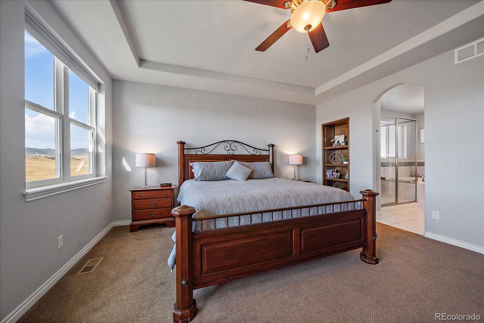 8412 Quaker Circle Arvada, CO 80007 - Photo 19 of 44 a bedroom with a bed and window
