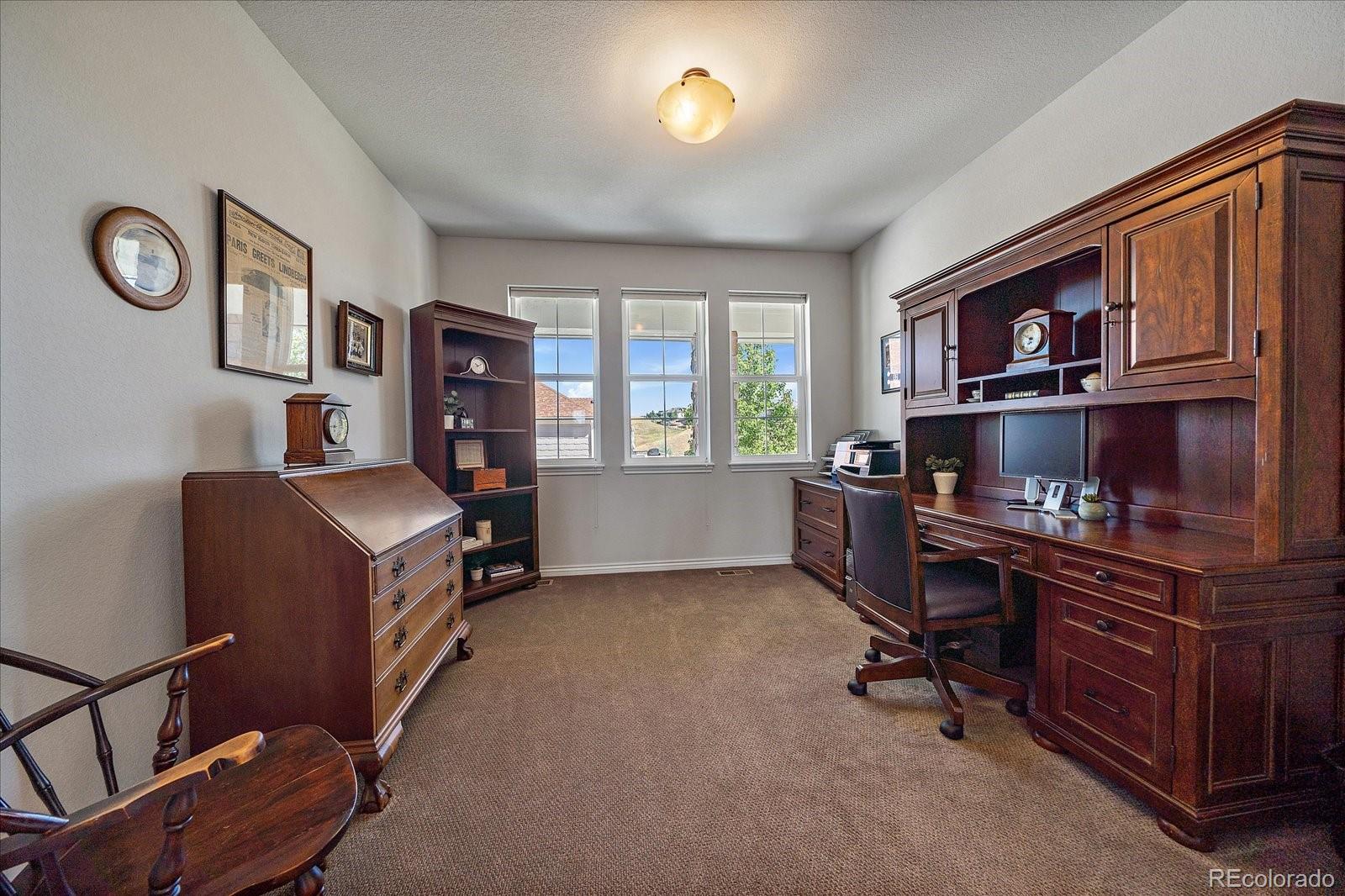 8412 Quaker Circle Arvada, CO 80007 - Photo 24 of 44 a workspace with furniture and window