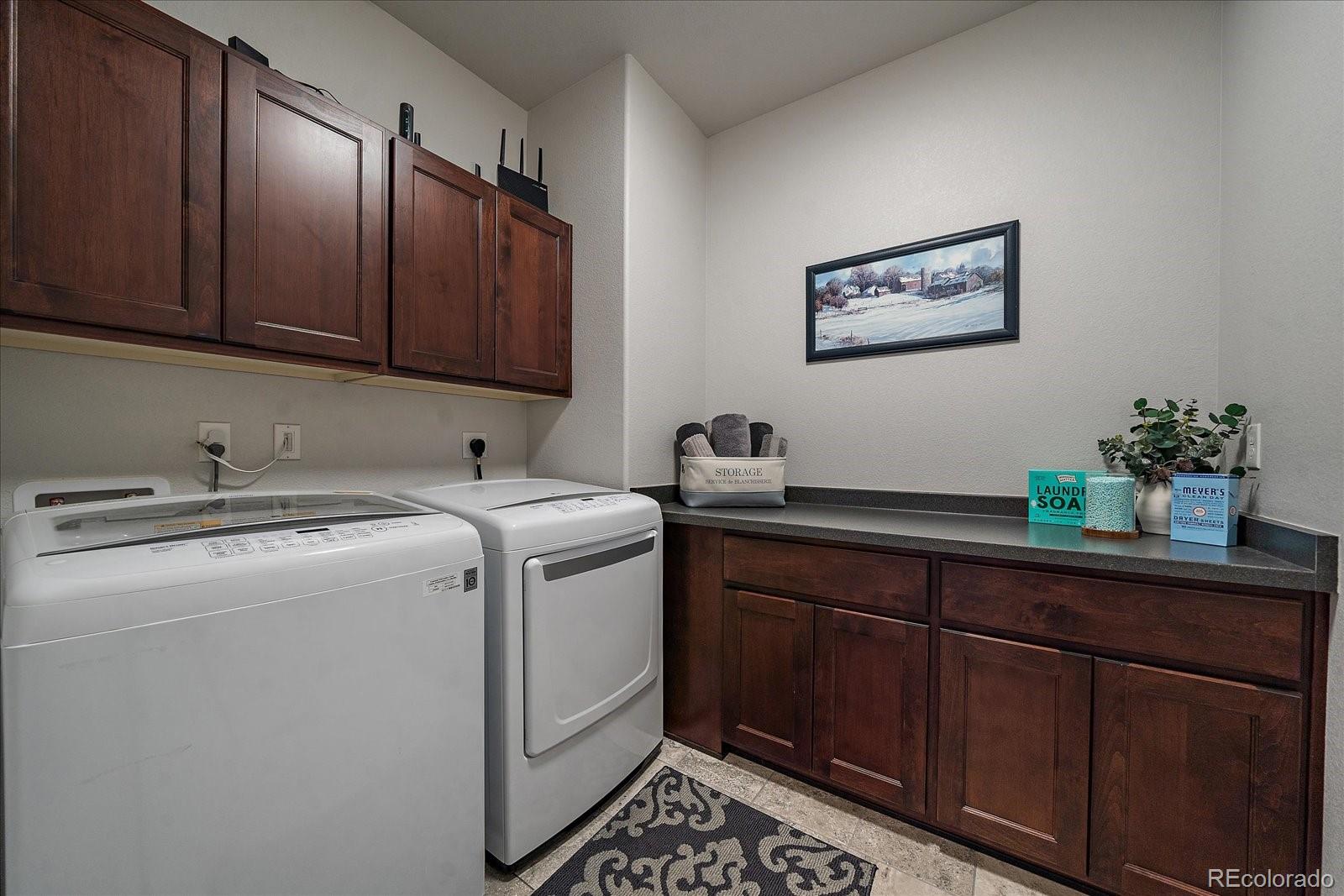 8412 Quaker Circle Arvada, CO 80007 - Photo 27 of 44 a utility room with dryer and washer