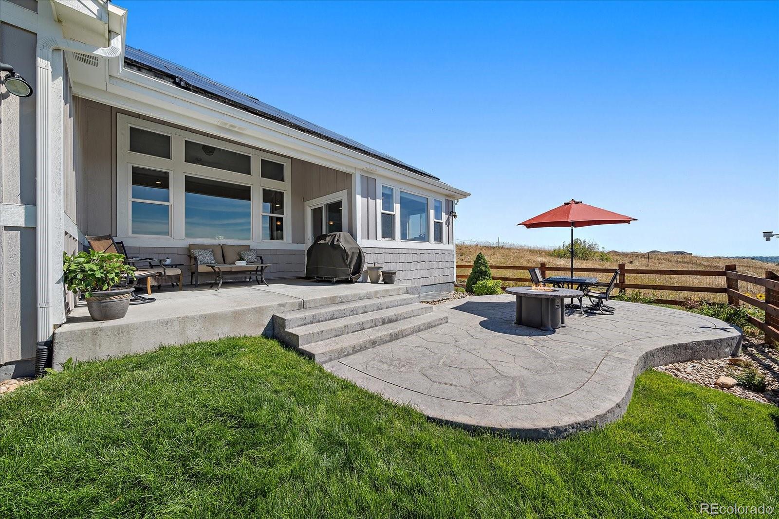 8412 Quaker Circle Arvada, CO 80007 - Photo 36 of 44 a view of a house with swimming pool and sitting area