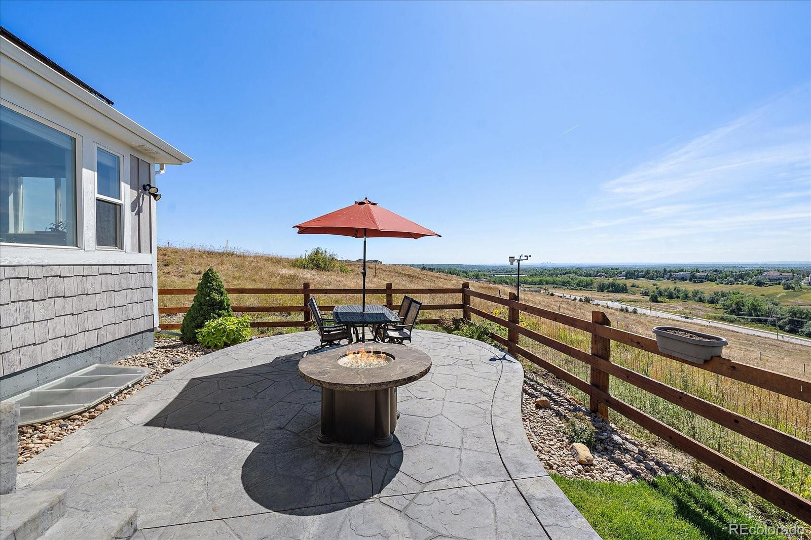 8412 Quaker Circle Arvada, CO 80007 - Photo 37 of 44 a view of a patio with furniture and a backyard
