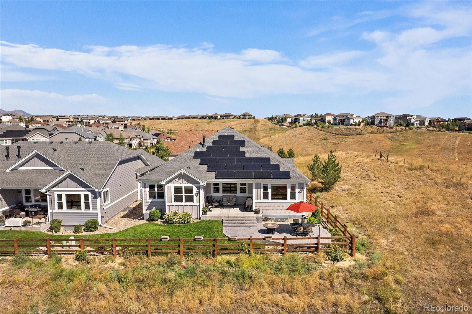 8412 Quaker Circle Arvada, CO 80007 - Photo 40 of 44 a aerial view of a house with swimming pool and ocean view