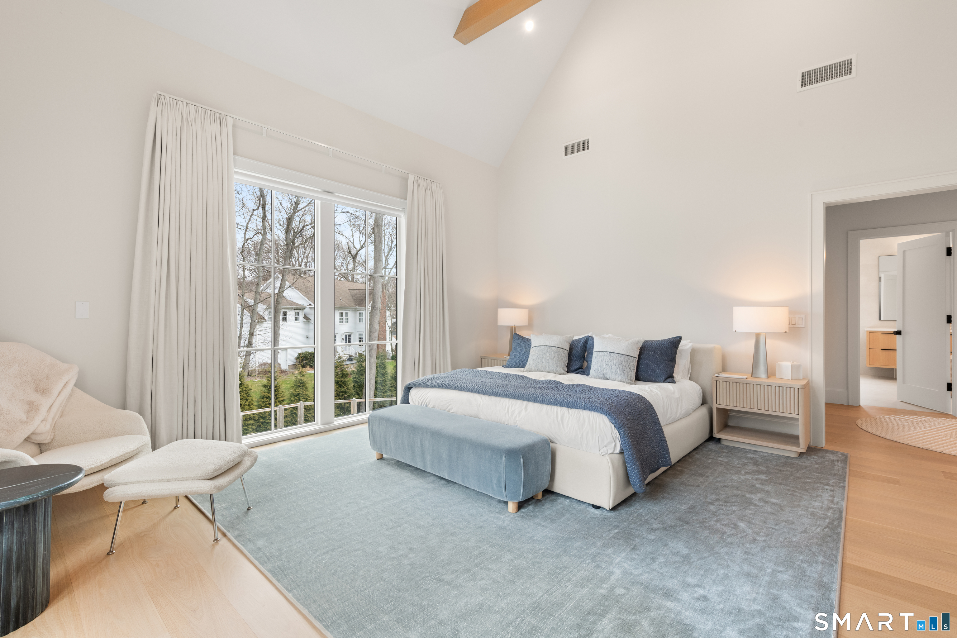 19 Mortar Rock Road Westport, CT 06880 - Photo 26 of 39 a spacious bedroom with a bed and a large window