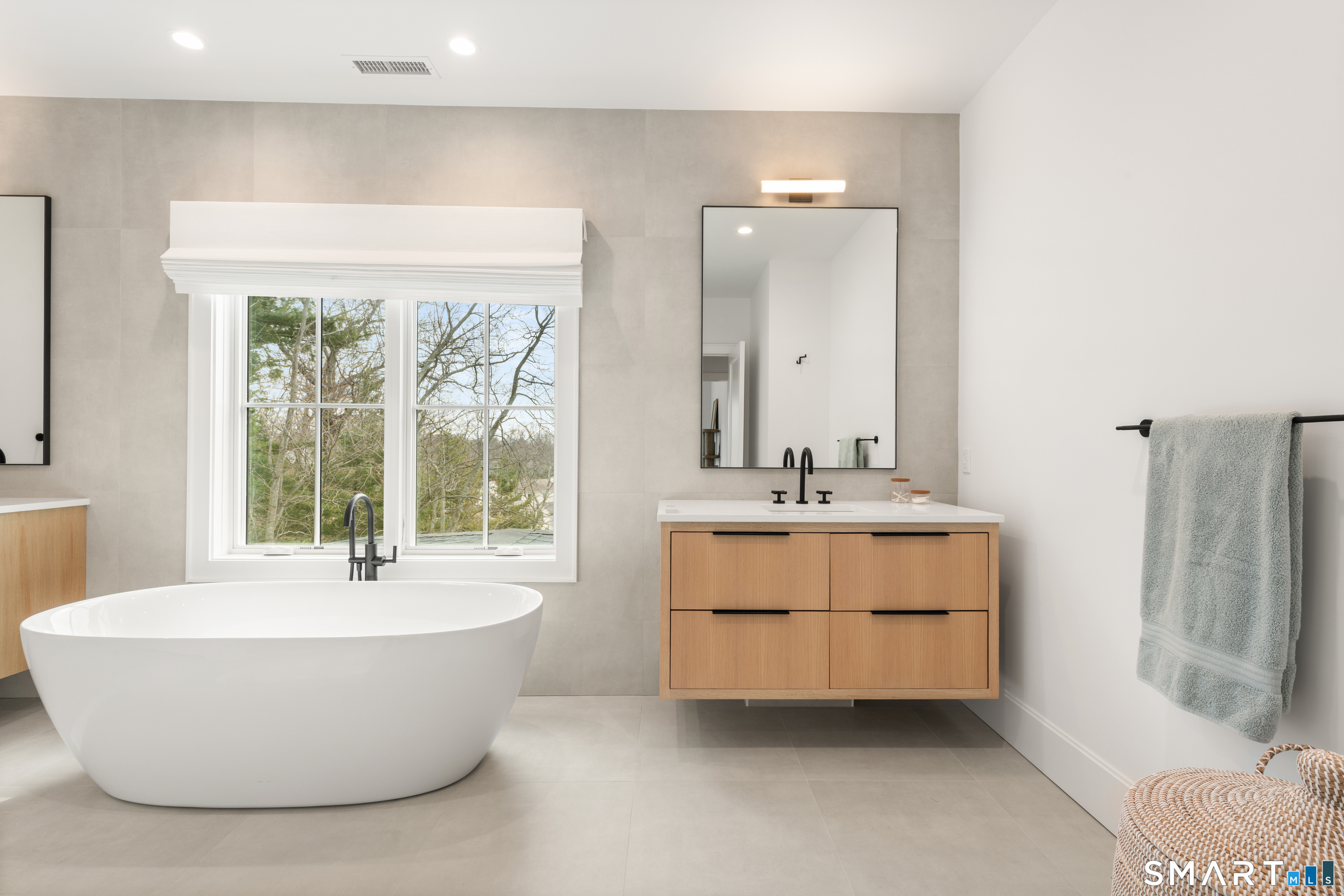 19 Mortar Rock Road Westport, CT 06880 - Photo 28 of 39 a bathroom with a bathtub a sink and a window