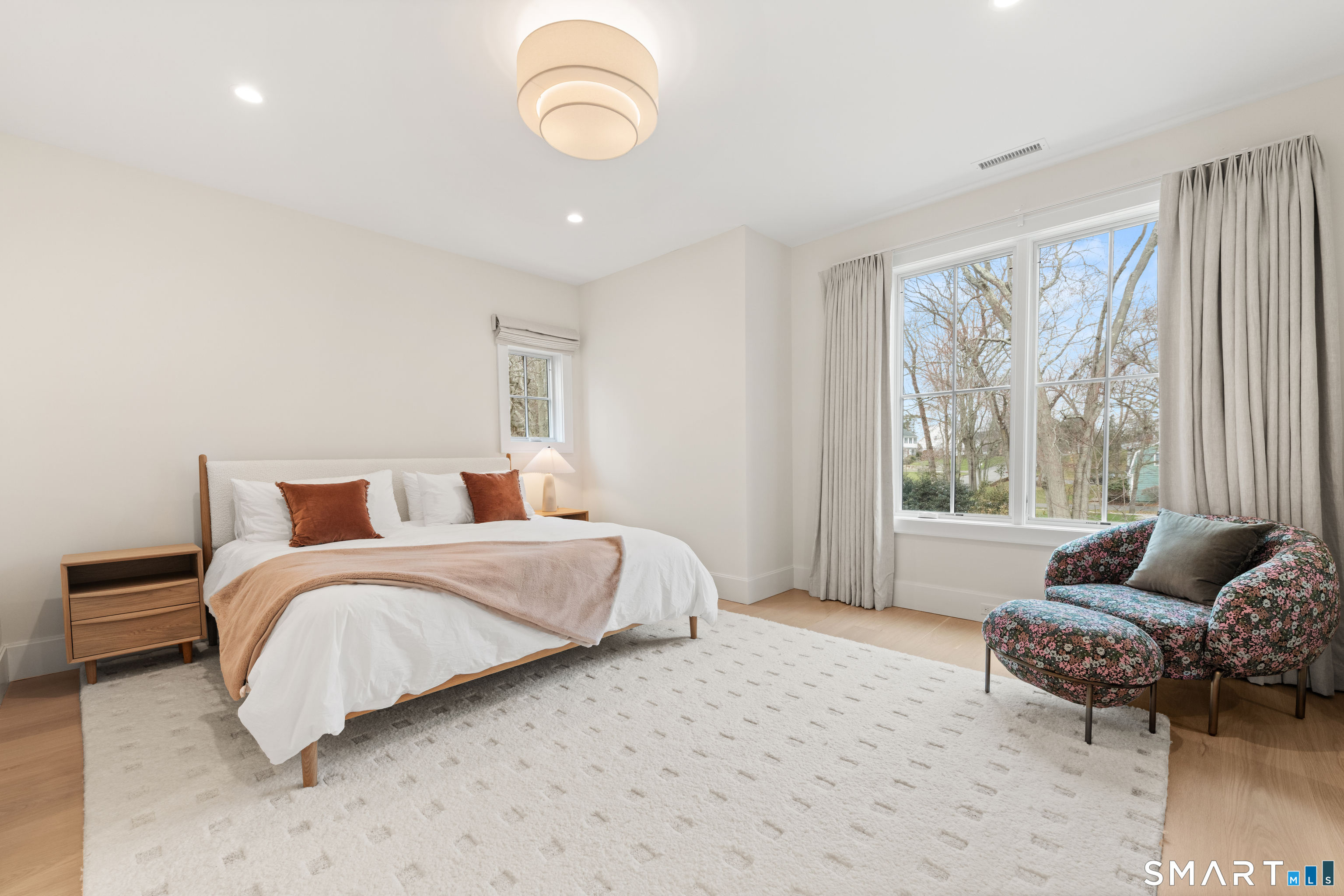 19 Mortar Rock Road Westport, CT 06880 - Photo 32 of 39 a spacious bedroom with a bed and a couch