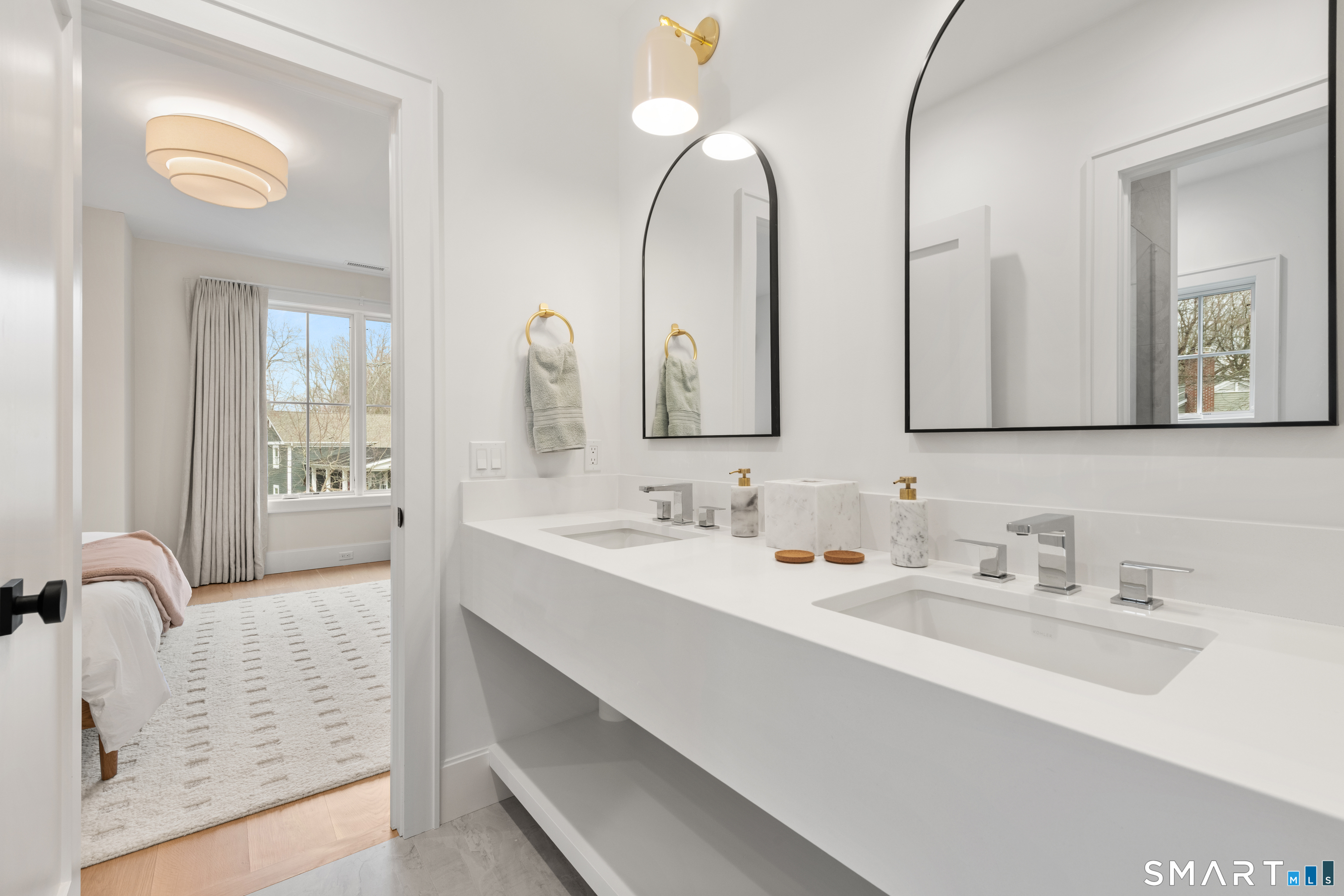 19 Mortar Rock Road Westport, CT 06880 - Photo 33 of 39 a bathroom with double vanity sinks and a mirror