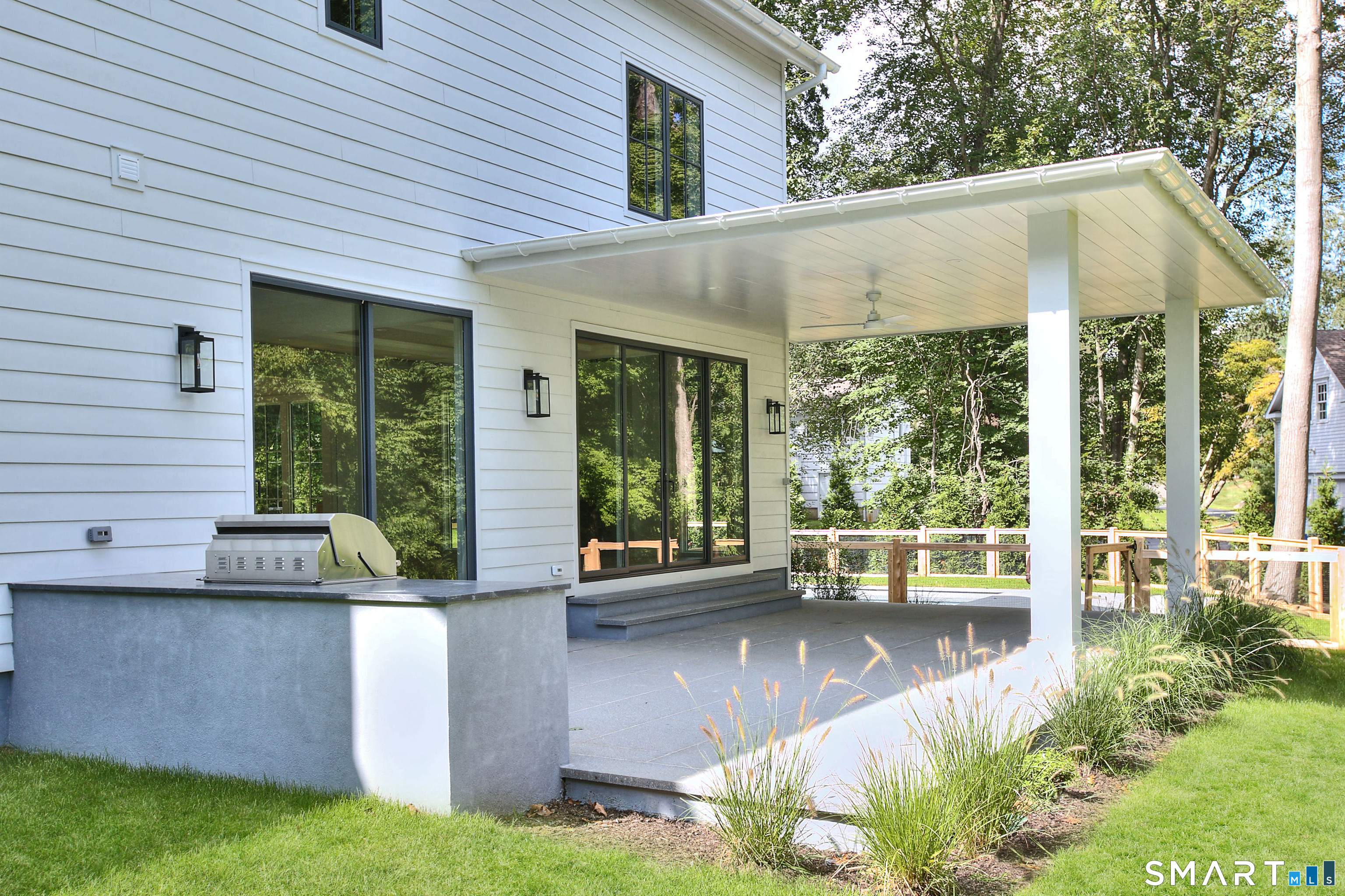 19 Mortar Rock Road Westport, CT 06880 - Photo 37 of 39 a view of a patio with table and chairs potted plants with large tree