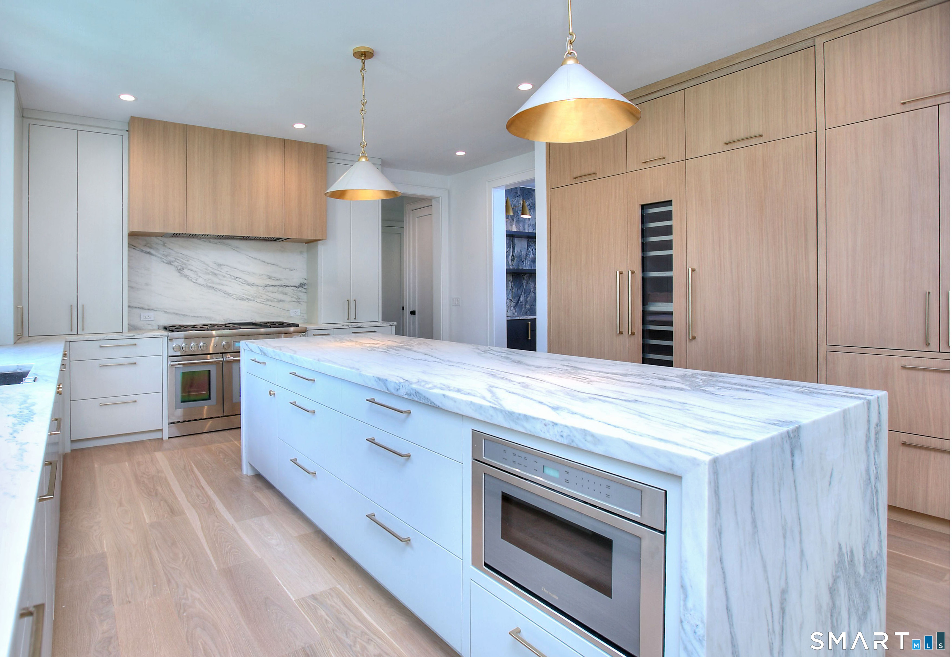 19 Mortar Rock Road Westport, CT 06880 - Photo 4 of 39 a kitchen with kitchen island a sink stainless steel appliances and cabinets