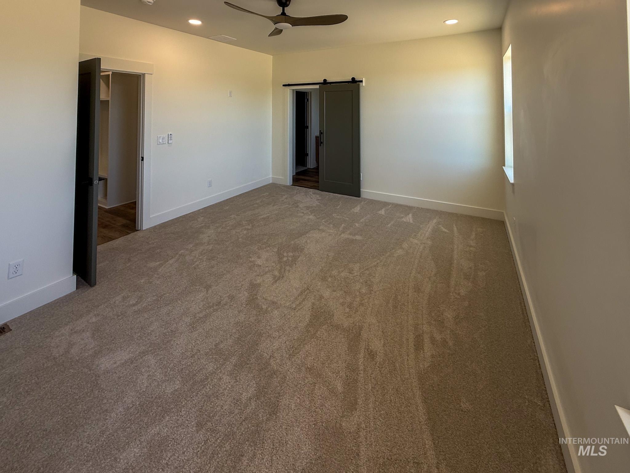 1108 Sage Rupert, ID 83350 - Photo 11 of 21 Expansive room featuring neutral-toned carpeting, a ceiling fan, recessed lighting, and a window providing natural illumination
