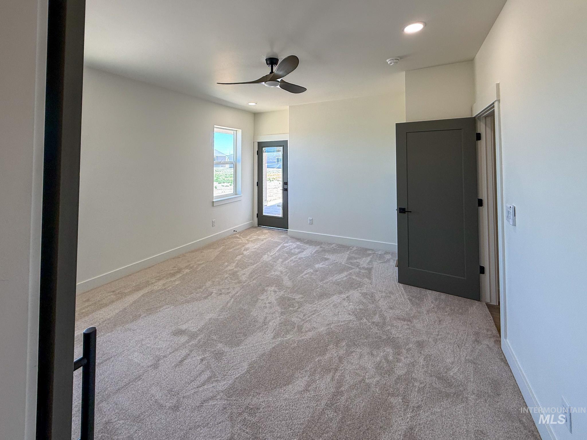 1108 Sage Rupert, ID 83350 - Photo 9 of 21 Spacious room featuring neutral carpeting, a modern ceiling fan, and recessed lighting