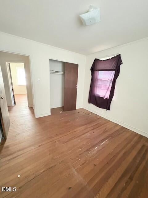1422 Carnage Drive Raleigh, NC 27610 - Photo 40 of 45 a view of empty room with wooden floor