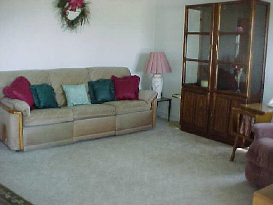 910 Windsor Road Loves Park, IL 61111 - Photo 2 of 6 a living room with furniture and a flat screen tv