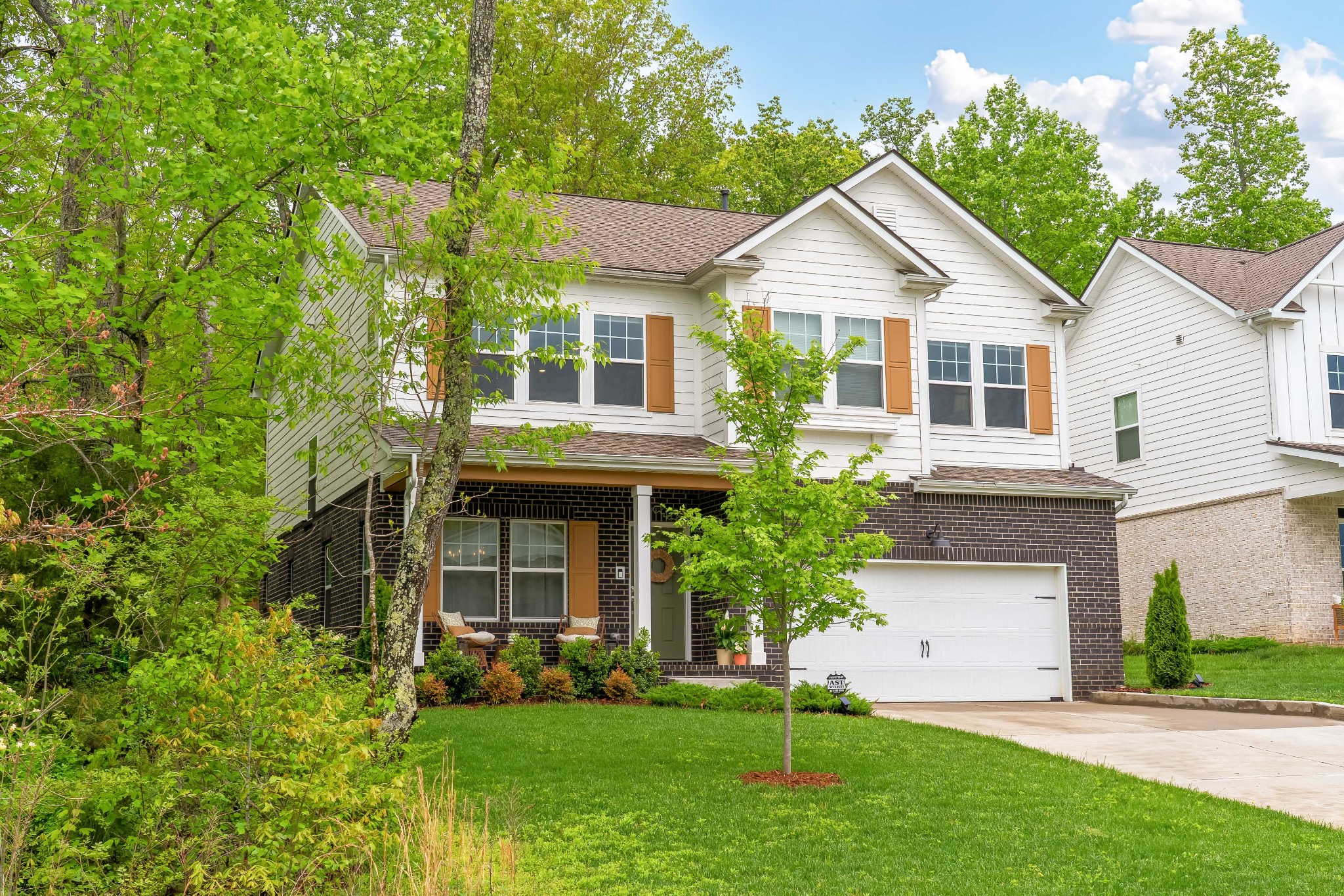 7301 Audubon Cove Fairview, TN 37062 - Photo 1 of 1 a view of a house with a yard and plants