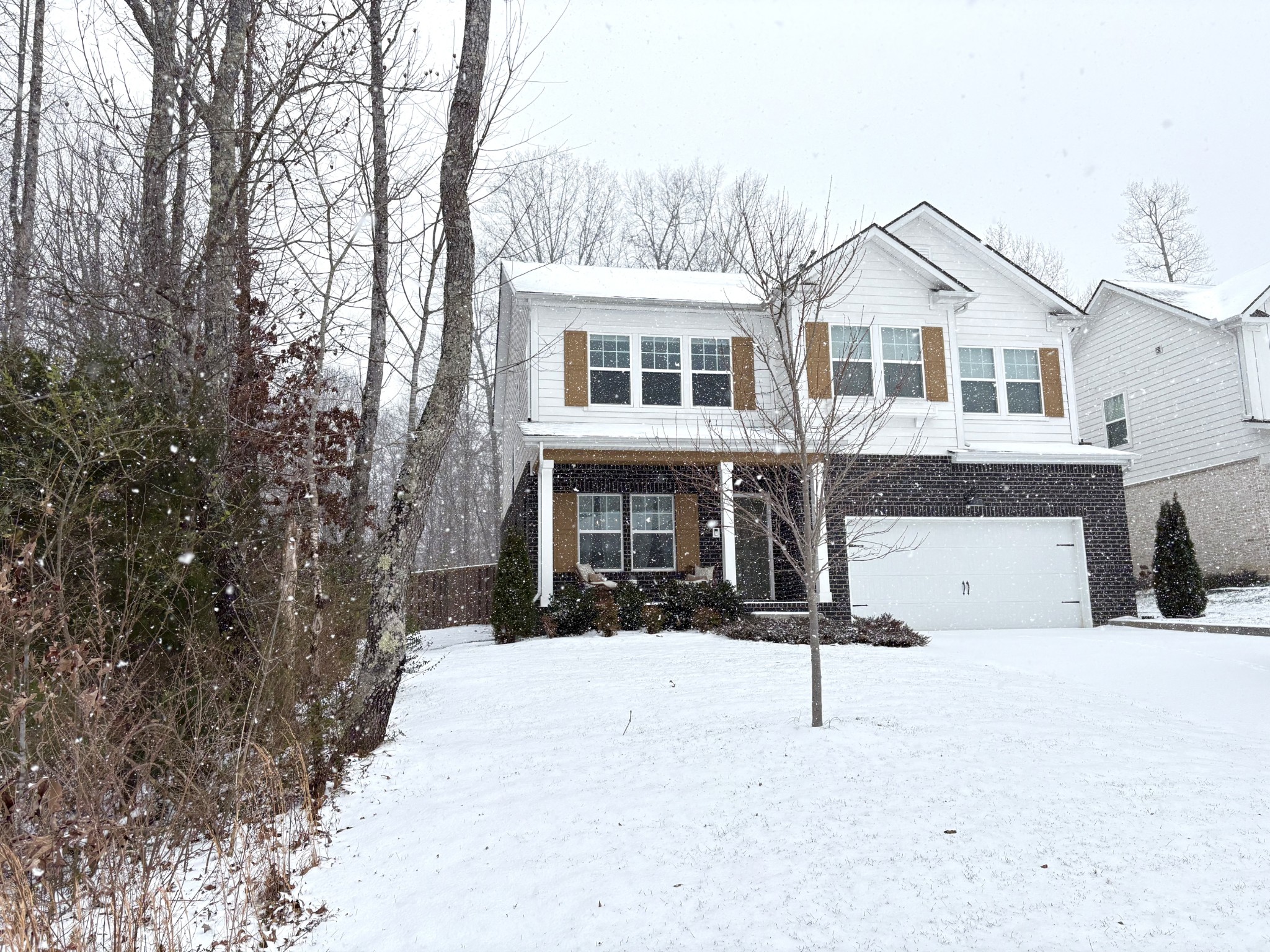 7301 Audubon Cove Fairview, TN 37062 - Photo 2 of 67 a view of house with yard and trees in the background