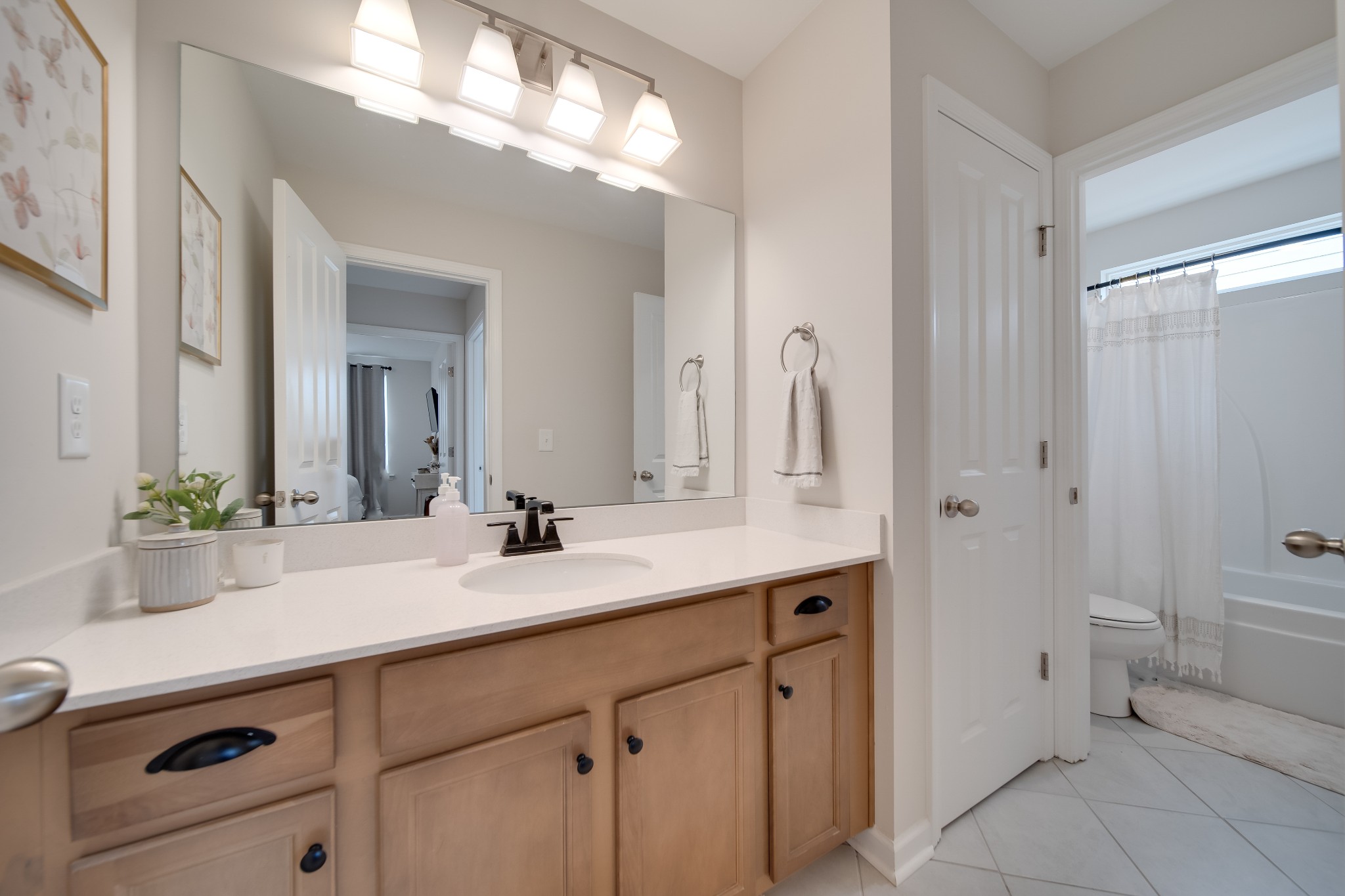 7301 Audubon Cove Fairview, TN 37062 - Photo 49 of 67 a bathroom with a sink and a mirror