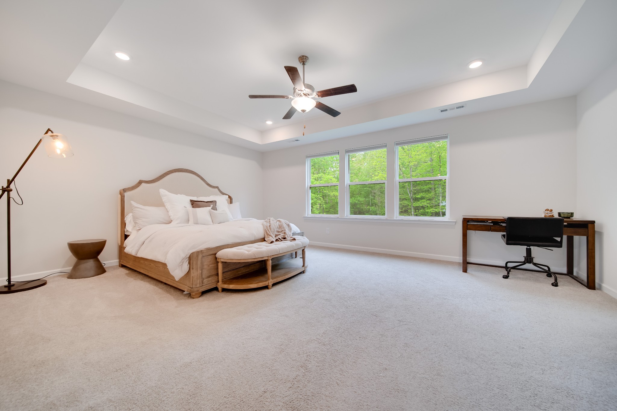 7301 Audubon Cove Fairview, TN 37062 - Photo 56 of 67 a spacious bedroom with a bed and a chandelier