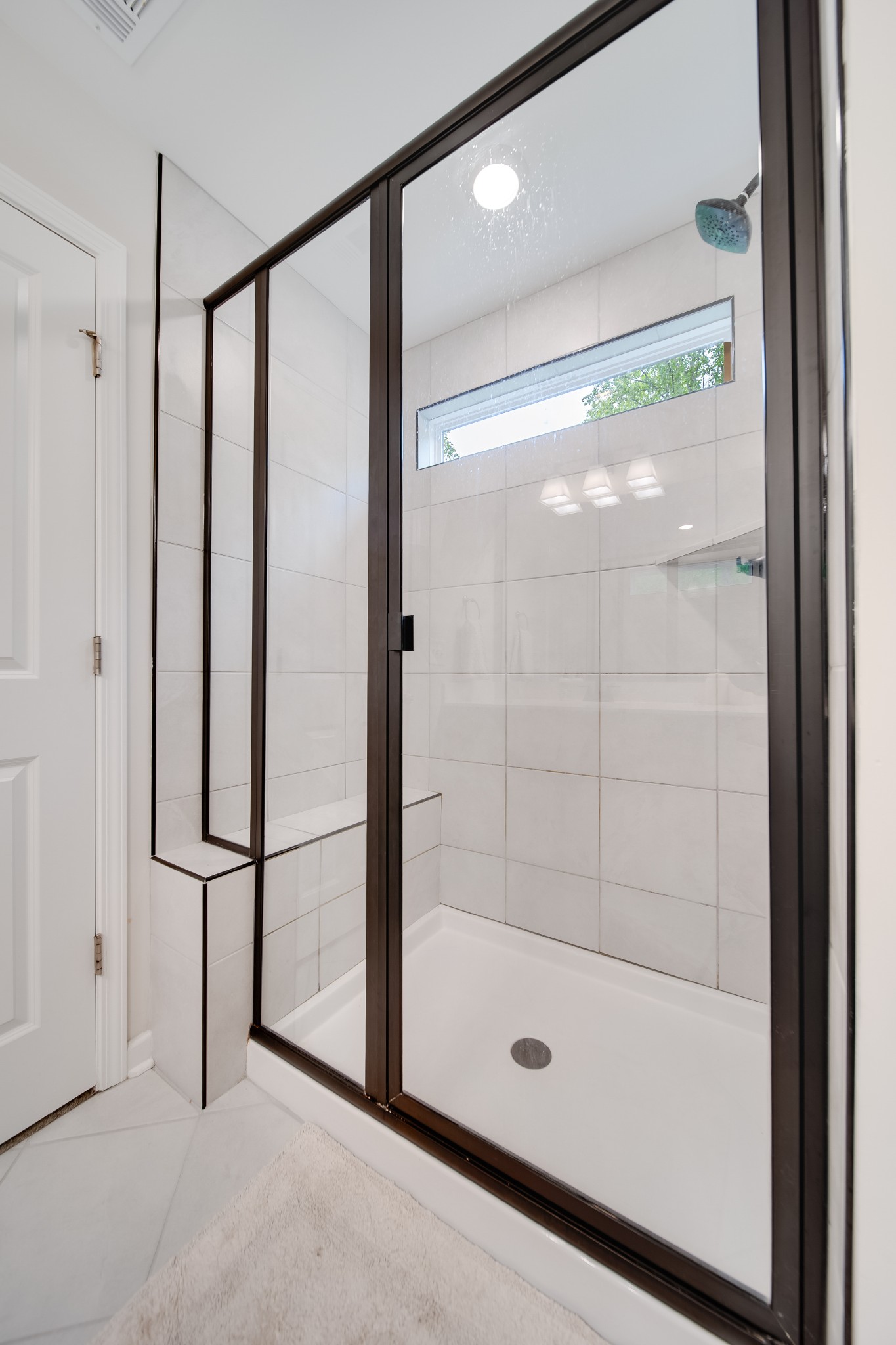 7301 Audubon Cove Fairview, TN 37062 - Photo 61 of 67 a bathroom with a glass shower door