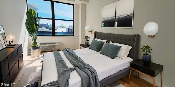 a spacious bedroom with a bed and window