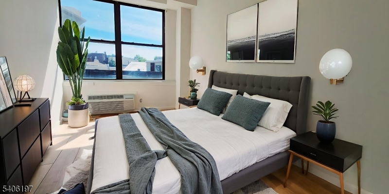 30 Howe Avenue Passaic, NJ 07055 - Photo 8 of 10 a spacious bedroom with a bed and window