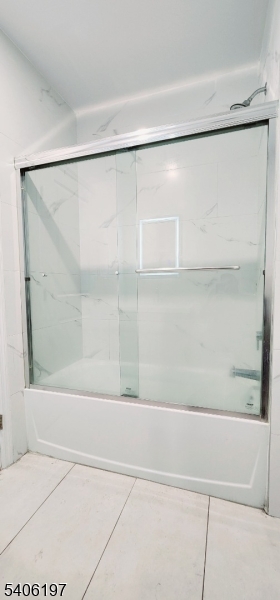 30 Howe Avenue Passaic, NJ 07055 - Photo 10 of 10 a bathroom with a shower and a bath tub