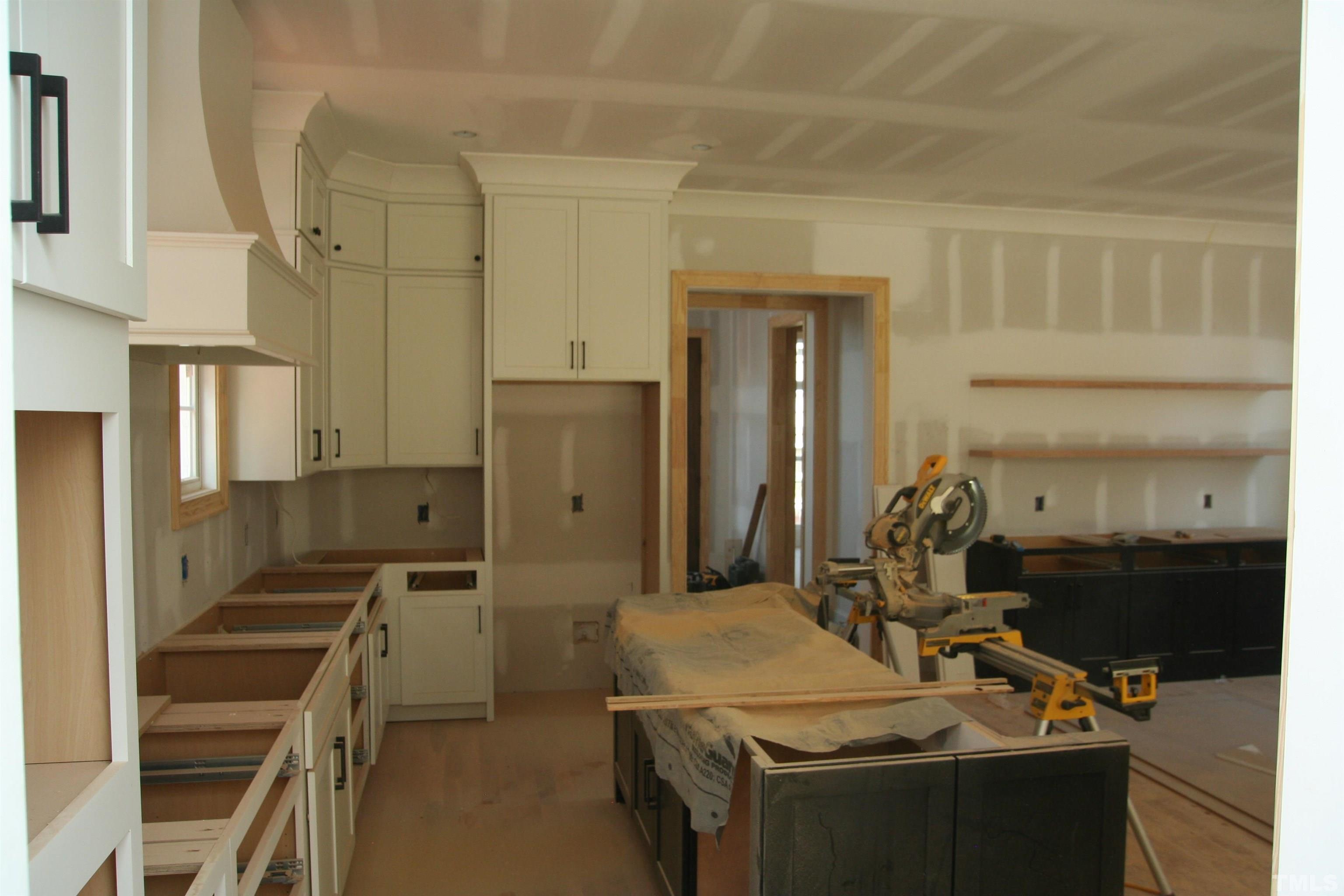 3025 Farrior Road Raleigh, NC 27607 - Photo 11 of 15 a kitchen with a sink stove and refrigerator