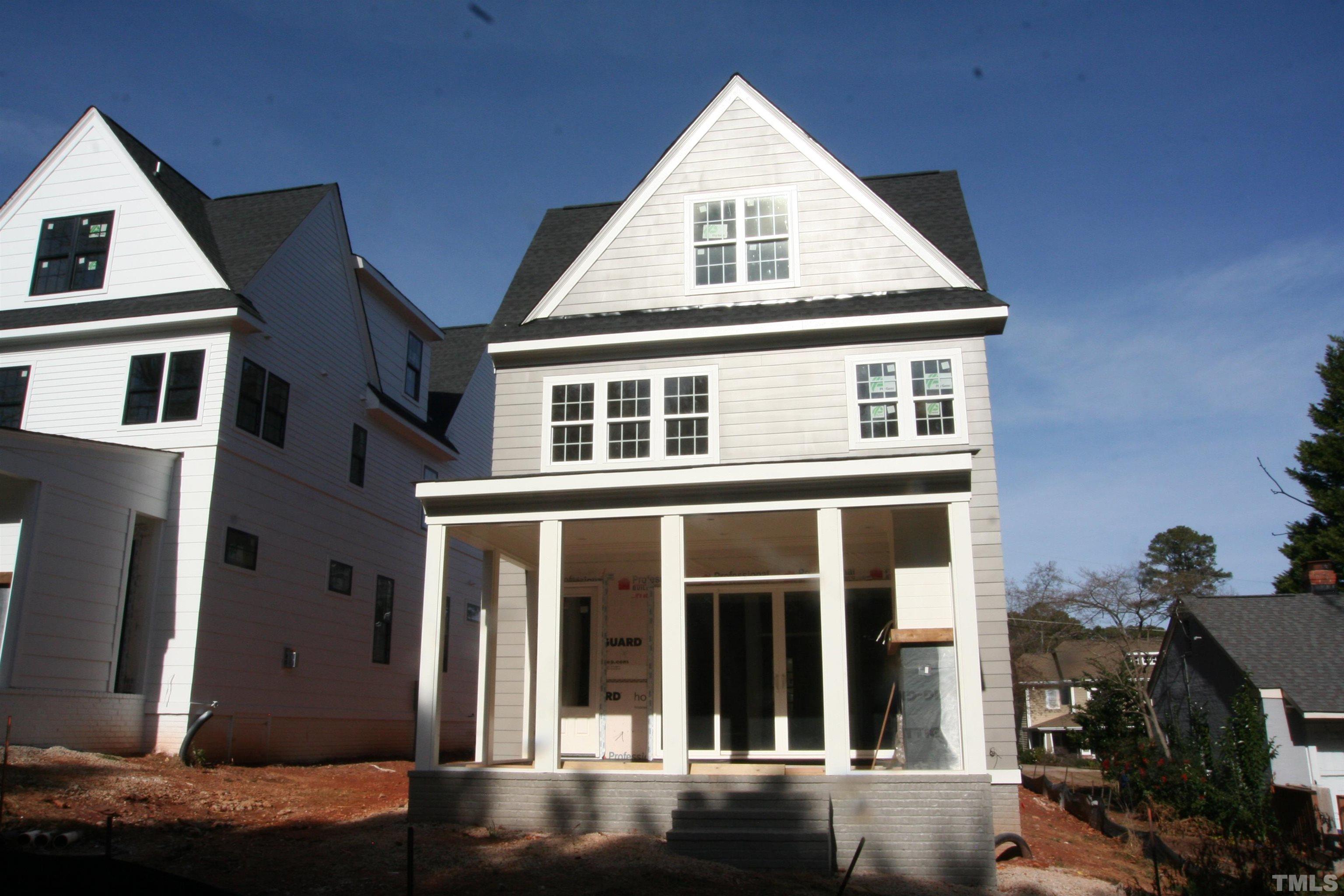 3025 Farrior Road Raleigh, NC 27607 - Photo 14 of 15 a view of a brick house with many windows