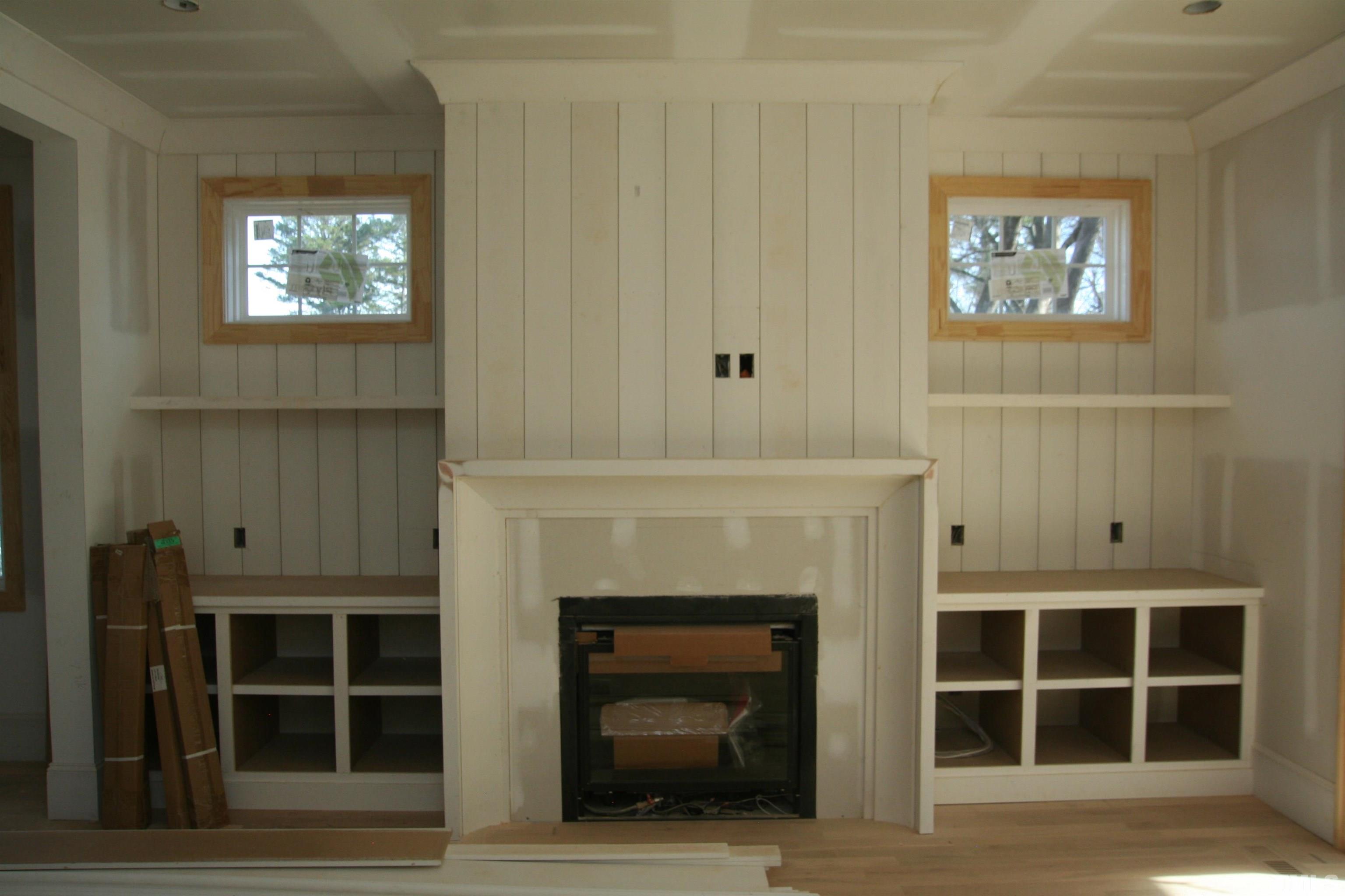 3025 Farrior Road Raleigh, NC 27607 - Photo 5 of 15 a living room with a fireplace and a window