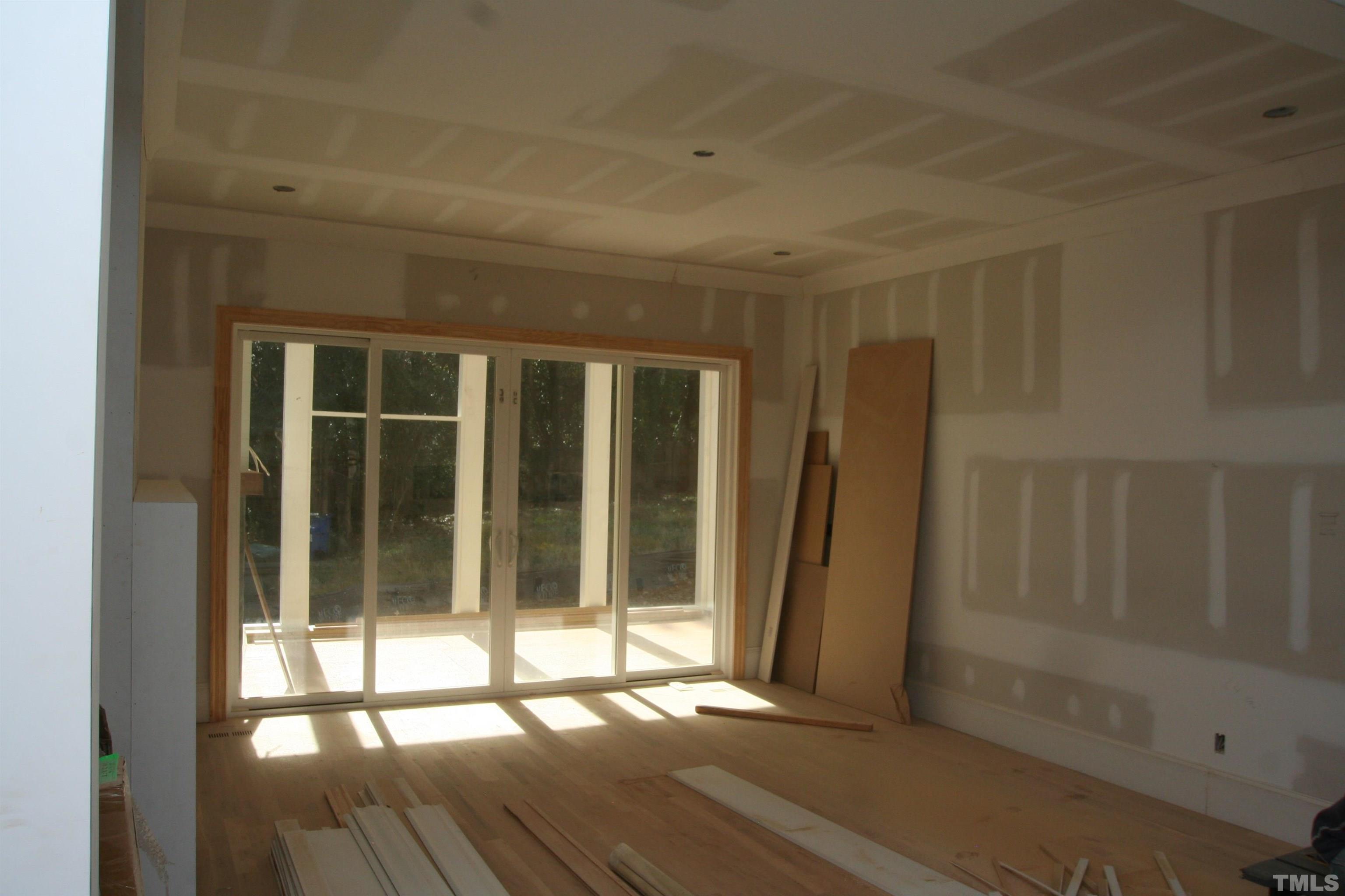 3025 Farrior Road Raleigh, NC 27607 - Photo 6 of 15 a view of empty room with wooden floor and fan