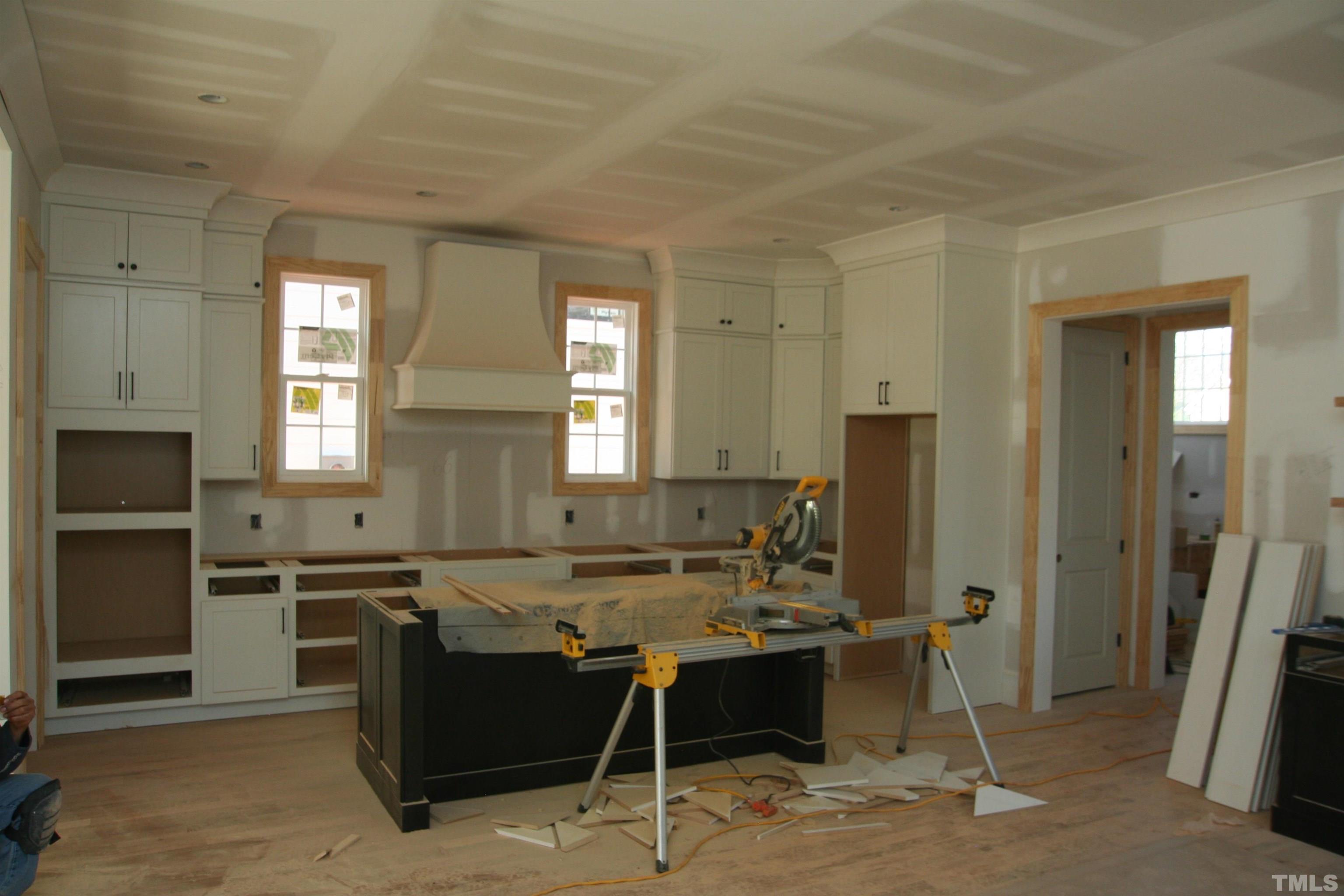 3025 Farrior Road Raleigh, NC 27607 - Photo 9 of 15 a kitchen with a sink cabinets and stainless steel appliances