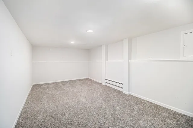 a bathroom with a toilet sink and shower