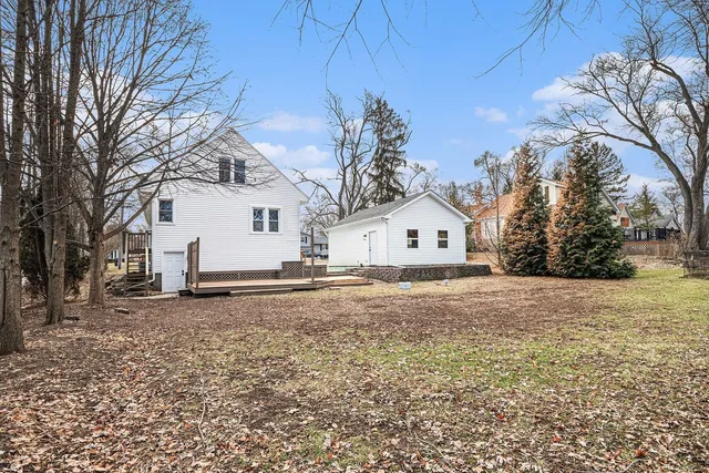 a view of a house with snow on the background