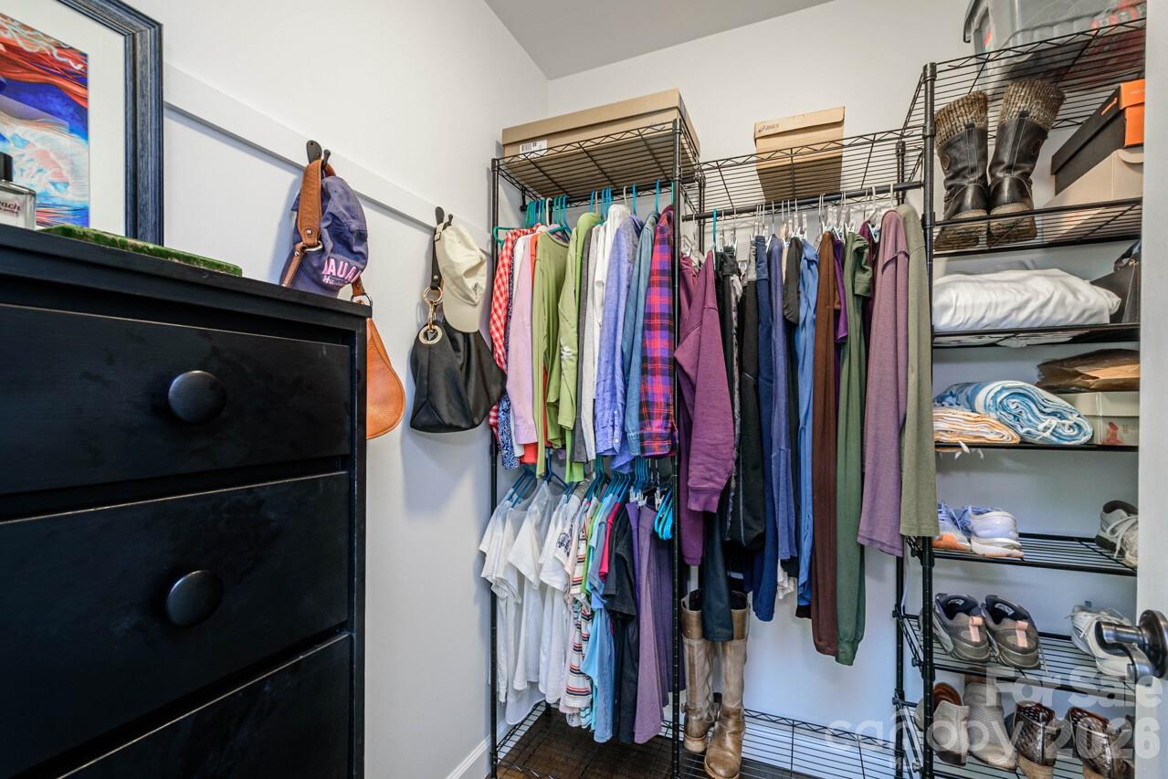 355 Mockingbird Drive Hendersonville, NC 28792 - Photo 25 of 45 a view of walk in closet with clothes and shoes