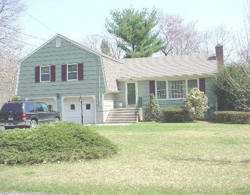 480 Mountain Laurel Road Fairfield, CT 06824 - Photo 1 of 1 a view of a house with a yard and plants
