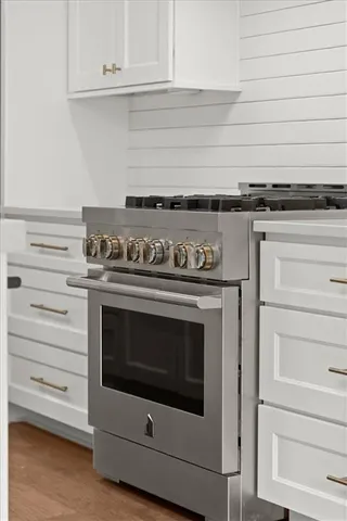a close view of a stove and a cabinets
