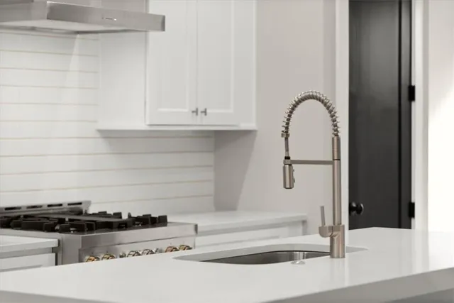 a view of a balcony with wooden floor and fence