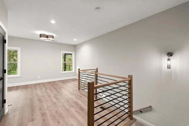a view of a backyard with plants and wooden fence