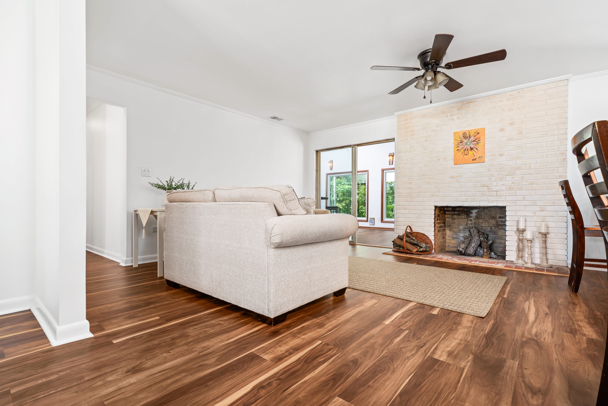 6045 Green Road Bloomington Springs, TN 38545 - Photo 11 of 42 a living room with furniture and a fireplace