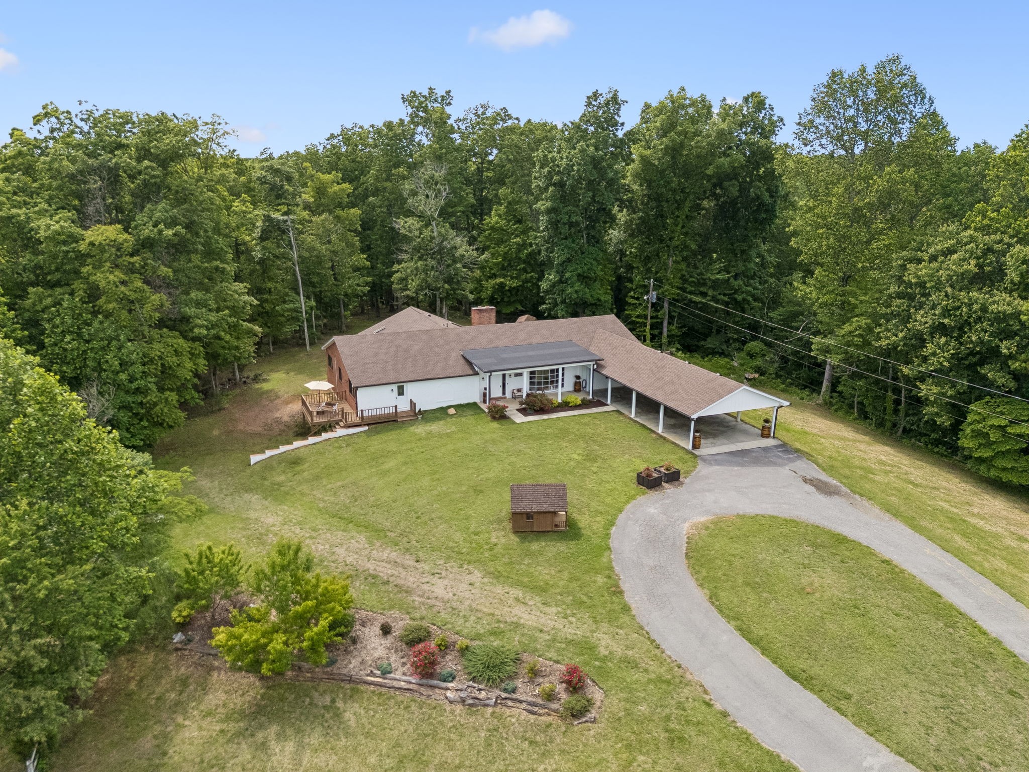 6045 Green Road Bloomington Springs, TN 38545 - Photo 43 of 45 an aerial view of a house with outdoor space