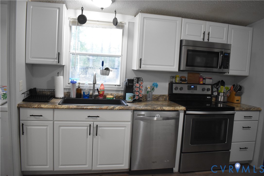 26049 Guy Place Road Courtland, VA 23837 - Photo 16 of 24 Updated kitchen featuring white shaker-style cabin
