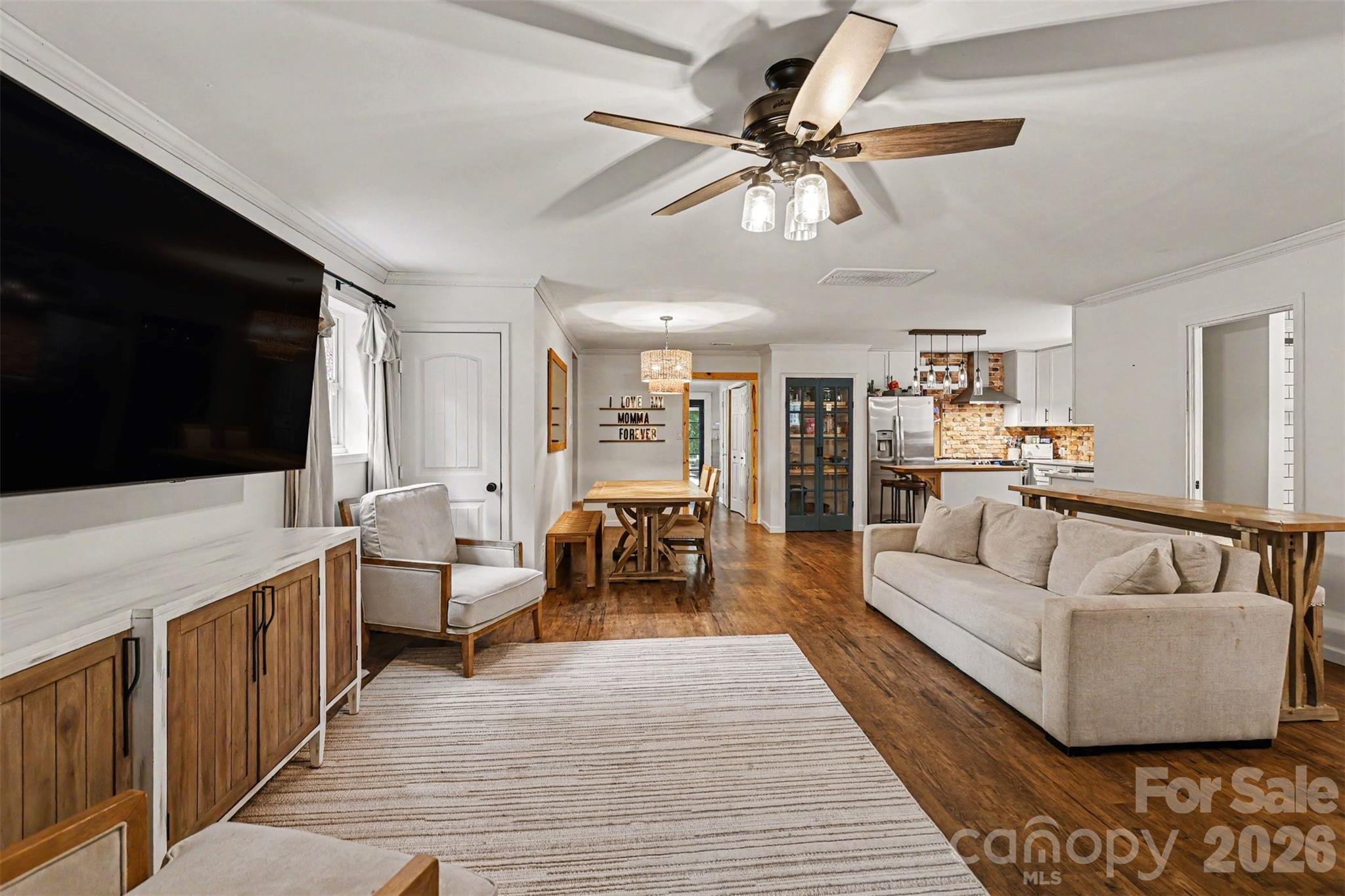 184 Canal Road Belmont, NC 28012 - Photo 19 of 39 a living room with furniture and a flat screen tv