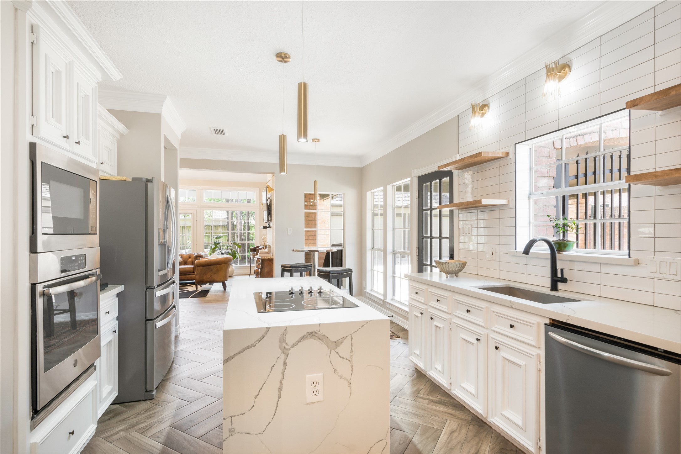 6211 Kingscrest Lane Spring, TX 77389 - Photo 16 of 38 a large kitchen with stainless steel appliances a large window and a counter space