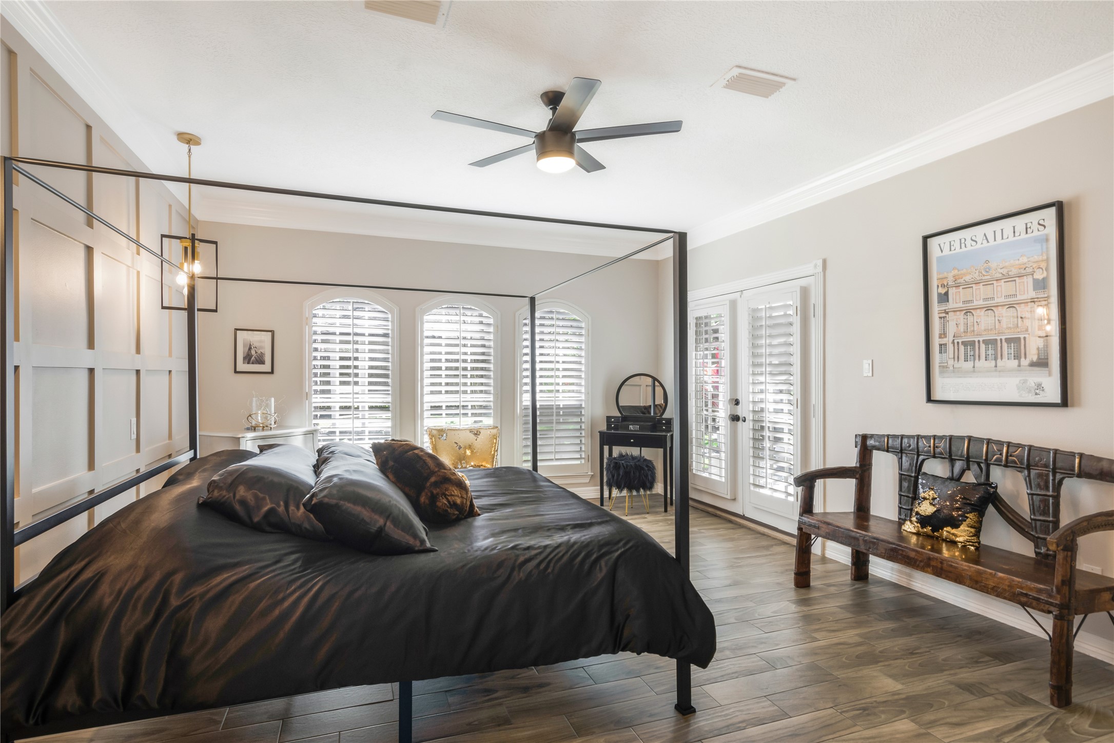 6211 Kingscrest Lane Spring, TX 77389 - Photo 20 of 38 a spacious bedroom with a bed a couch and a chandelier